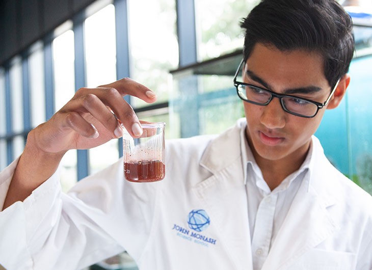 JMSS Student Looking At Flask