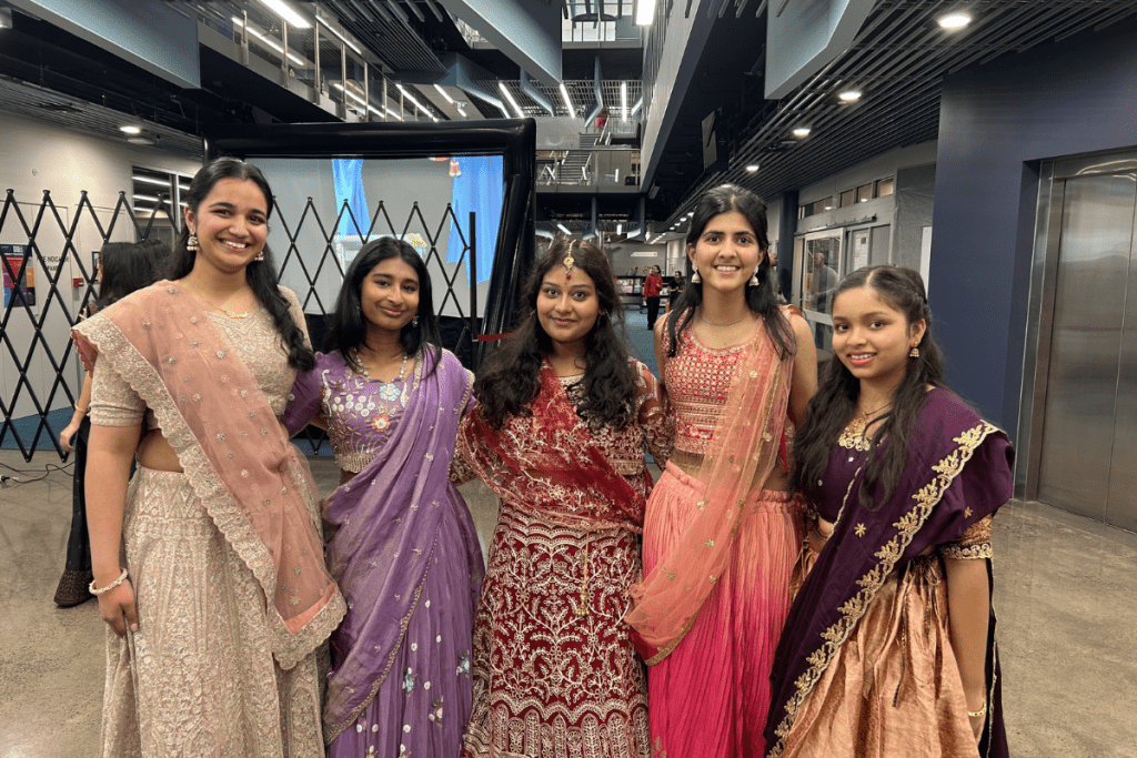 A group of students dressed in traditional indian dress