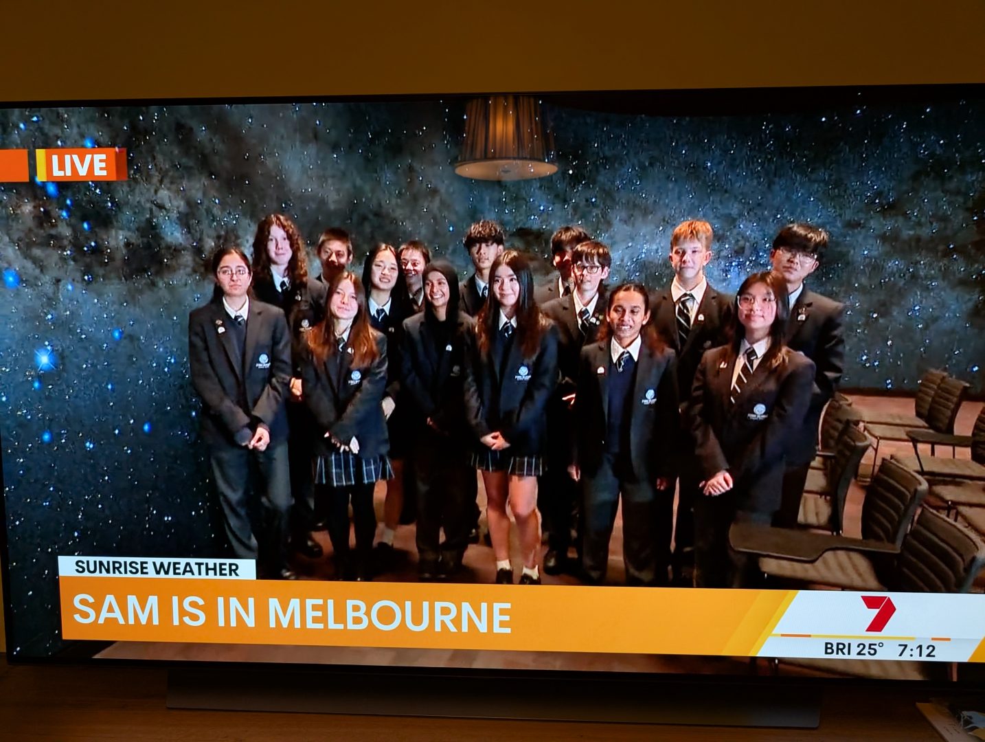 A picture of a group of students appearing in Channel Sunrise Weather program on TV